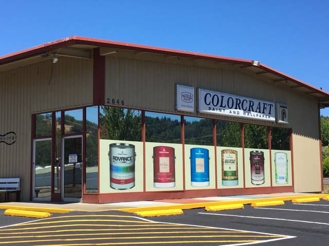A building with a sign that says colorcraft on it