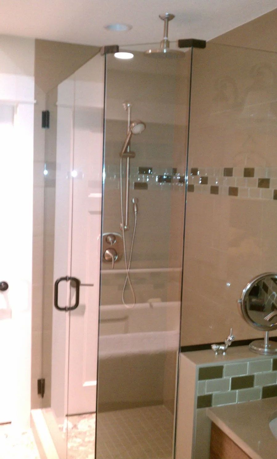 A bathroom with a walk in shower and a bathtub