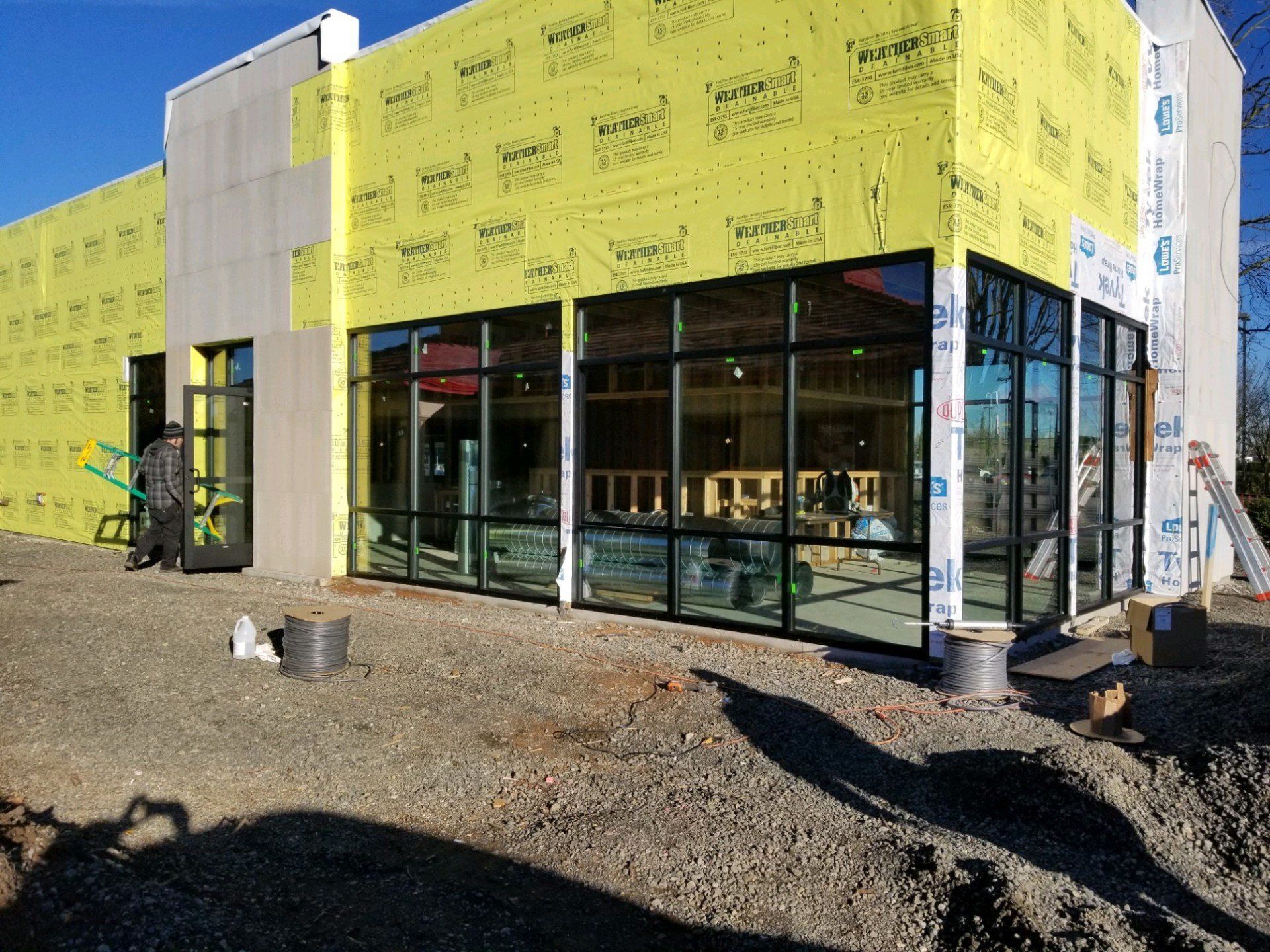 A building with a lot of windows is being built.