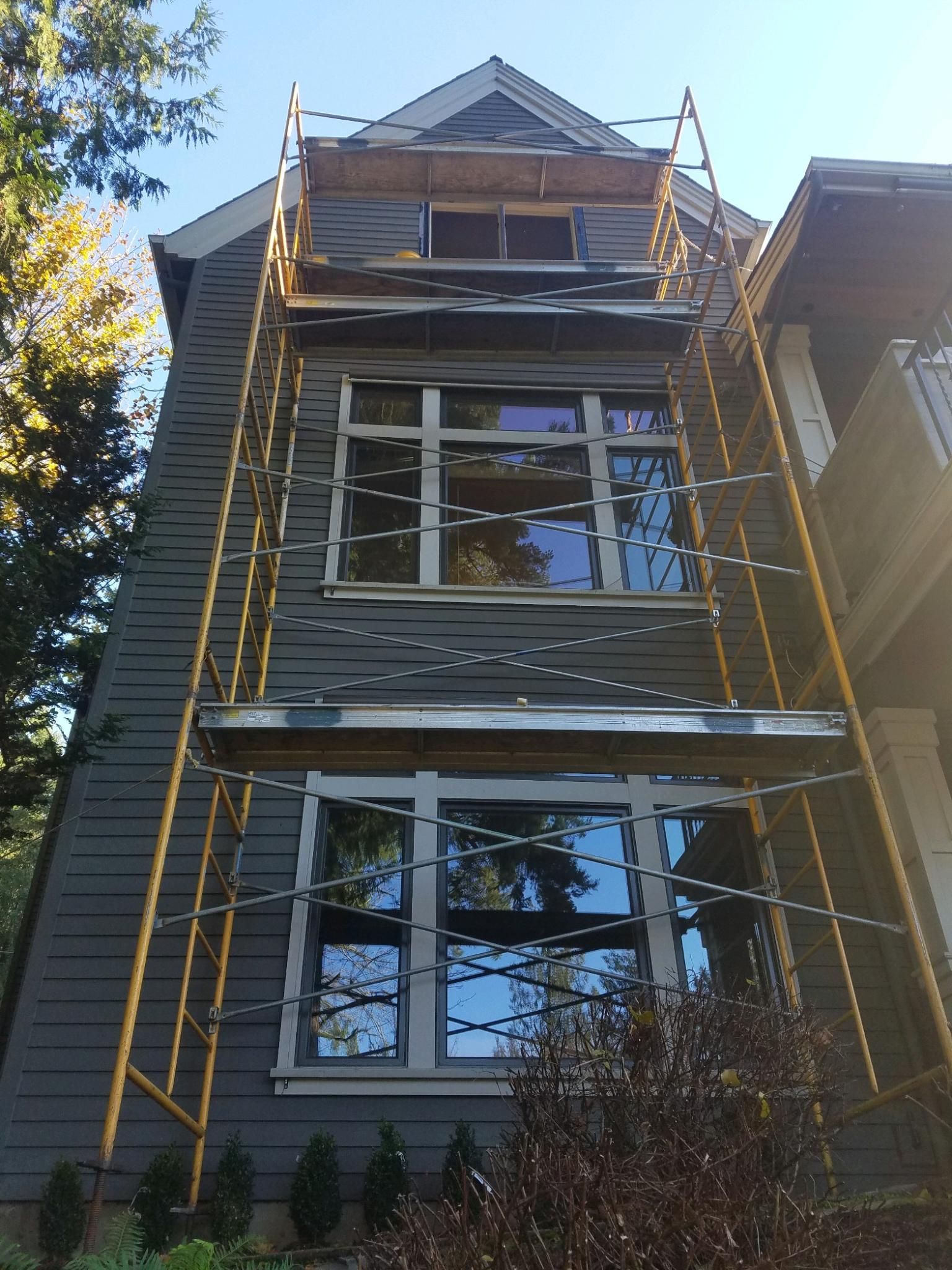 A house with a scaffolding on the side of it