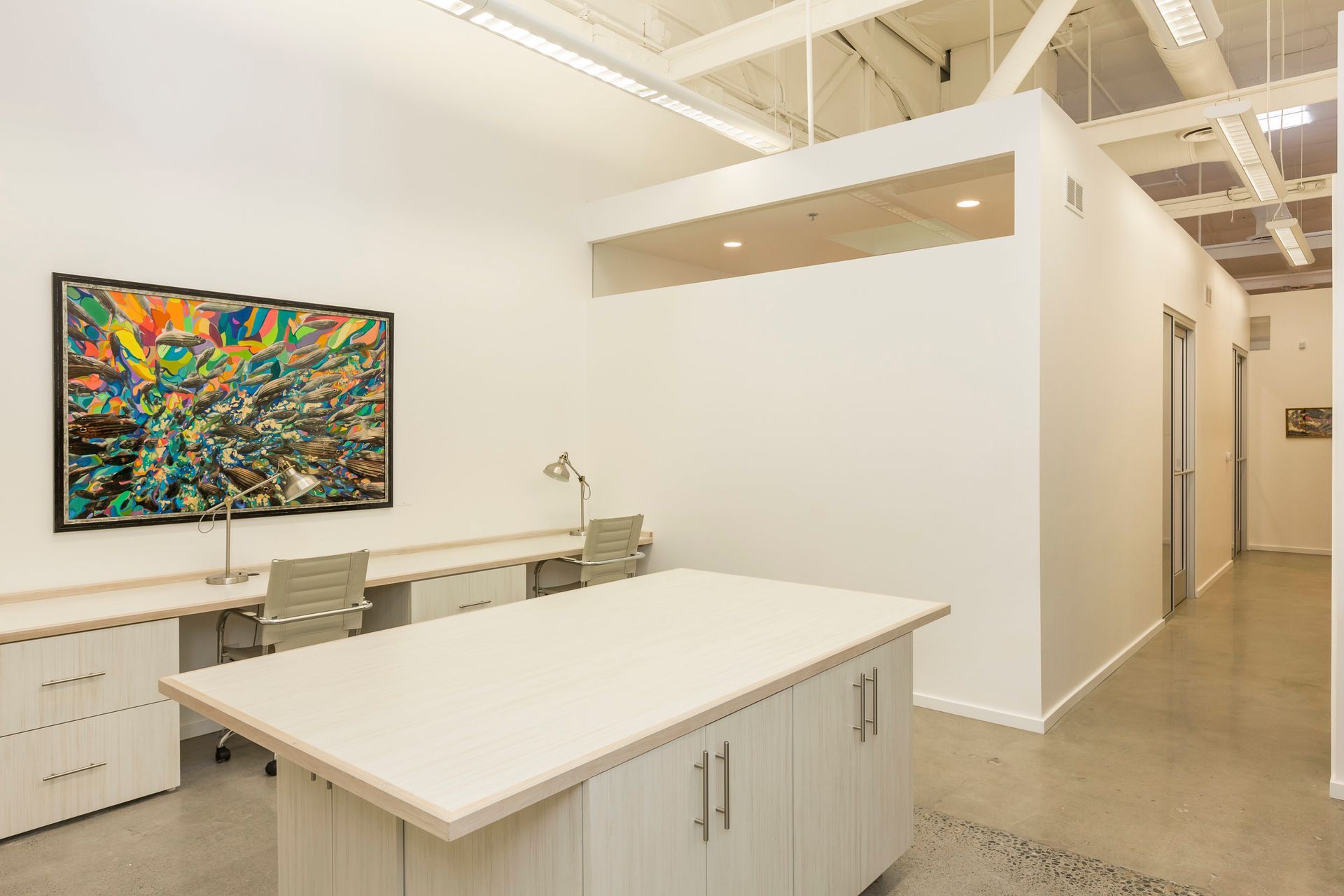 There is a large table in the middle of the room.