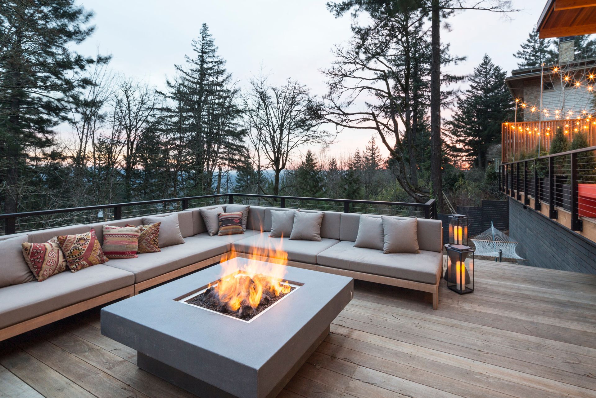 A patio with a fire pit in the middle of it