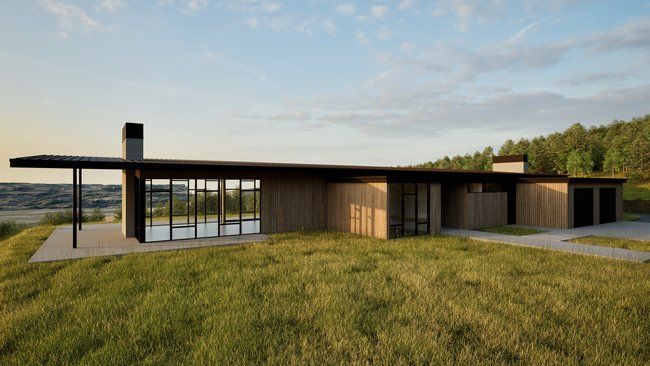 A large house is sitting in the middle of a grassy field.