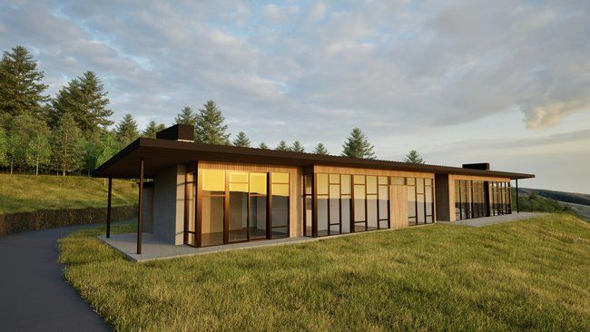 A large house is sitting on top of a grassy hill.