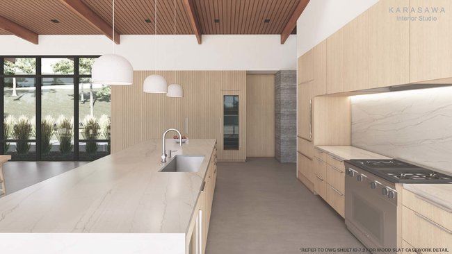 A kitchen with stainless steel appliances and wooden cabinets