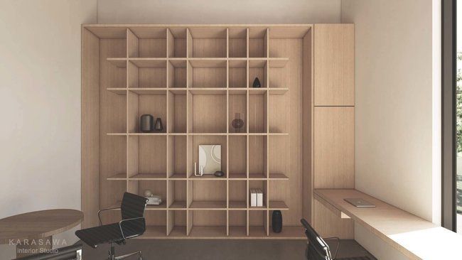 A room with a lot of shelves and a desk