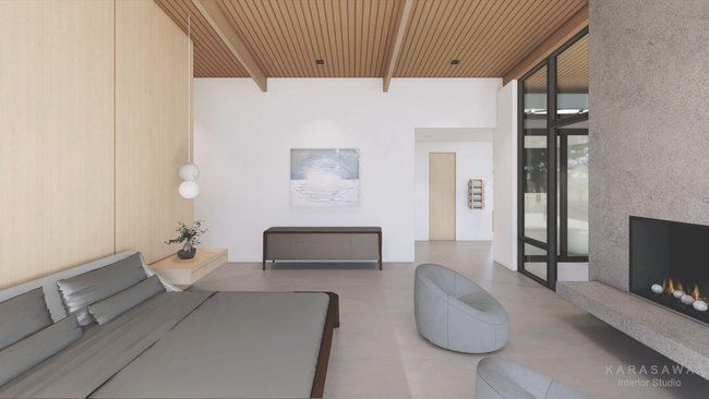 A bedroom with a fireplace and a large bed