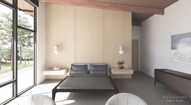 A bedroom with a large bed and a large window