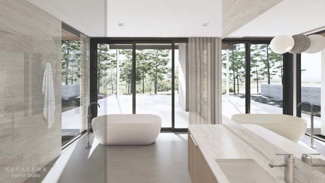 A bathroom with a bathtub, sink, and large windows.