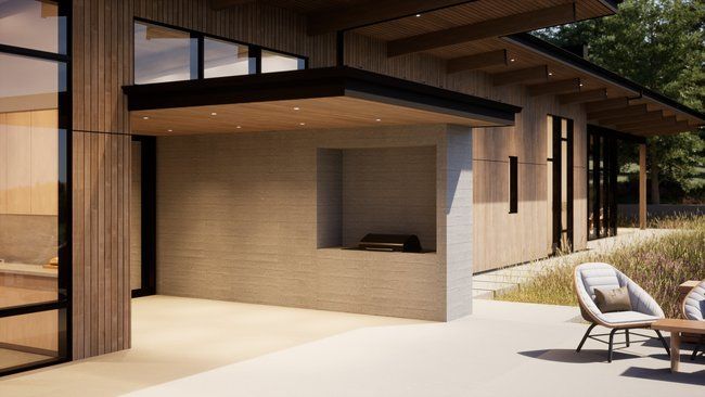 modern house with a patio and chairs.