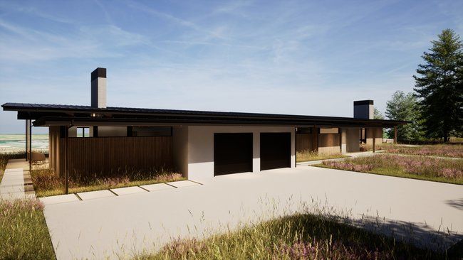 house with two garages and a driveway.