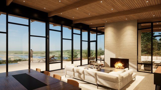 A living room with a fireplace and a lot of windows