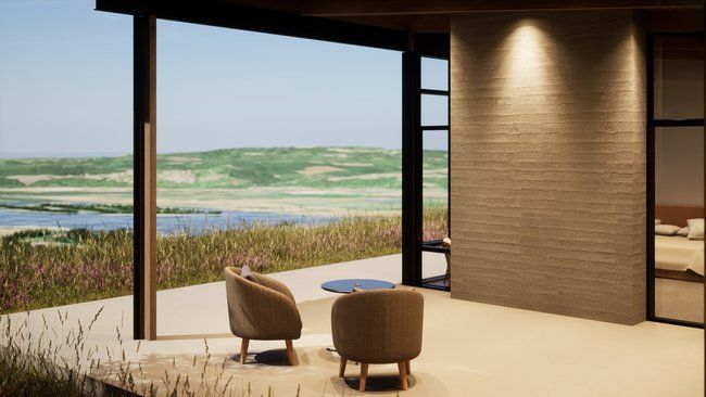 A room with two chairs and a table with a view of a lake.