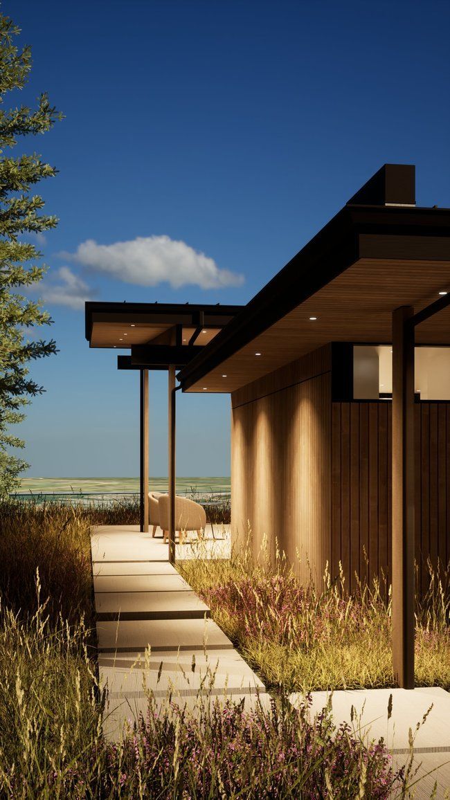 modern house with a walkway leading to it.