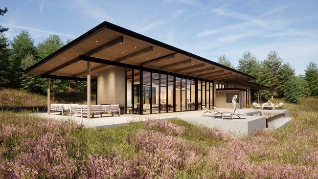 modern house in the middle of a field.