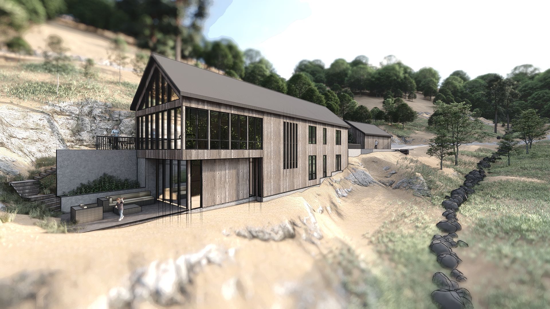 A large wooden house is sitting on top of a hill next to a river.