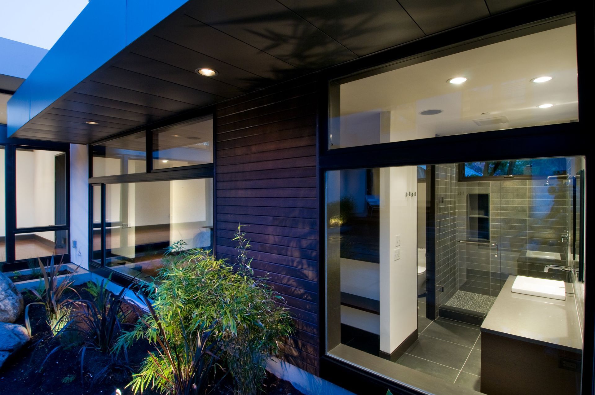 A modern house with a bathroom and a large window