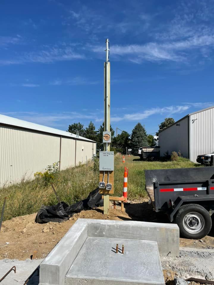 A truck is parked next to a pole