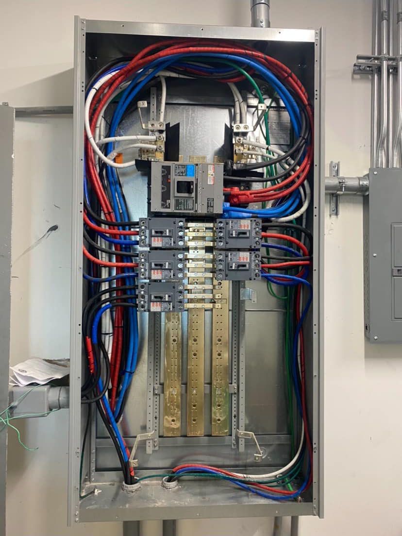 A electrical box with a lot of wires coming out of it