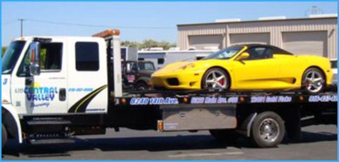 Yellow car on flatbed