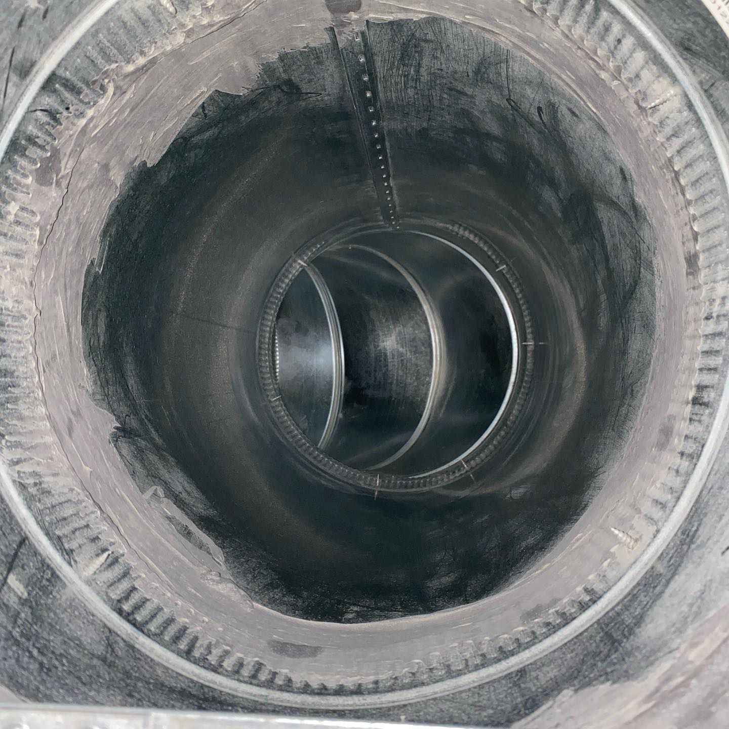 A close up of the inside of a metal pipe