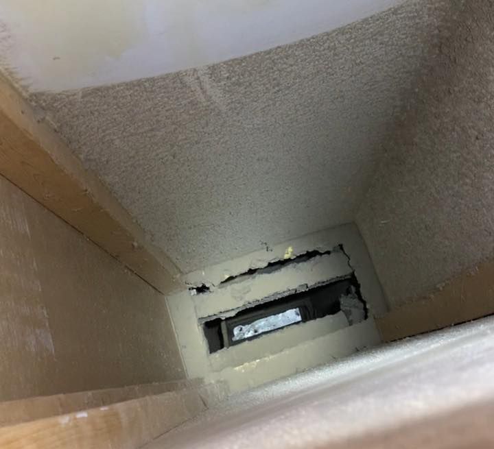 A picture of a hole in the ceiling of a room.