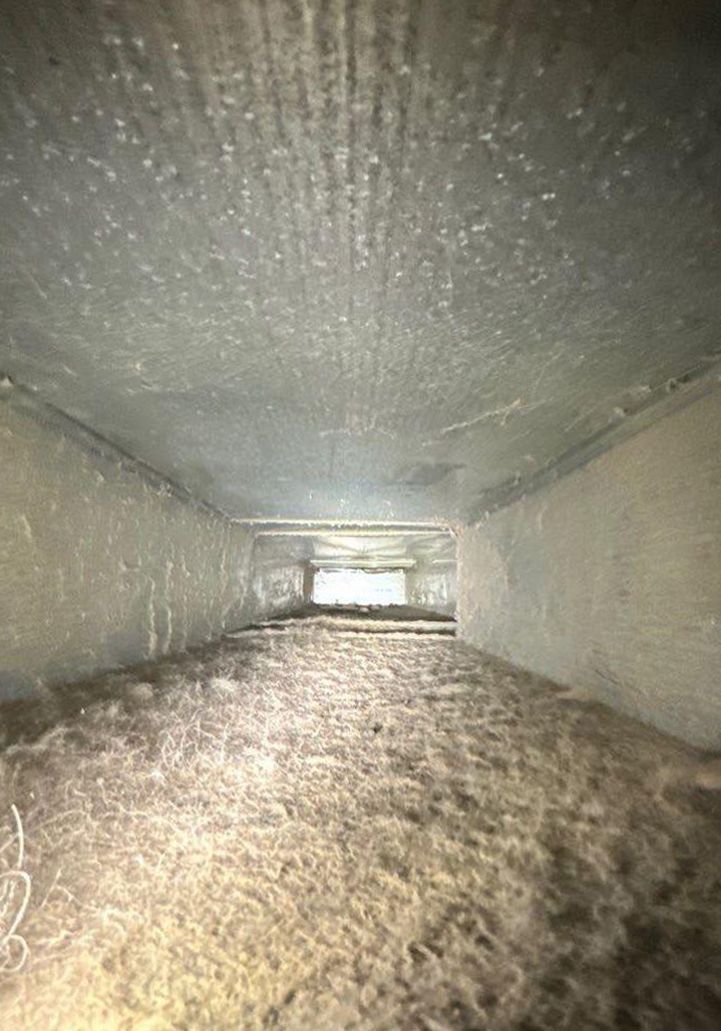 It looks like a tunnel with a lot of dust coming out of it.