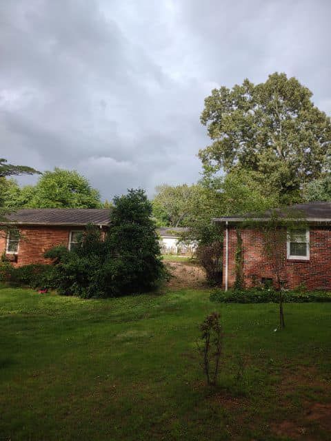 a couple of houses sitting next to each other on a cloudy day