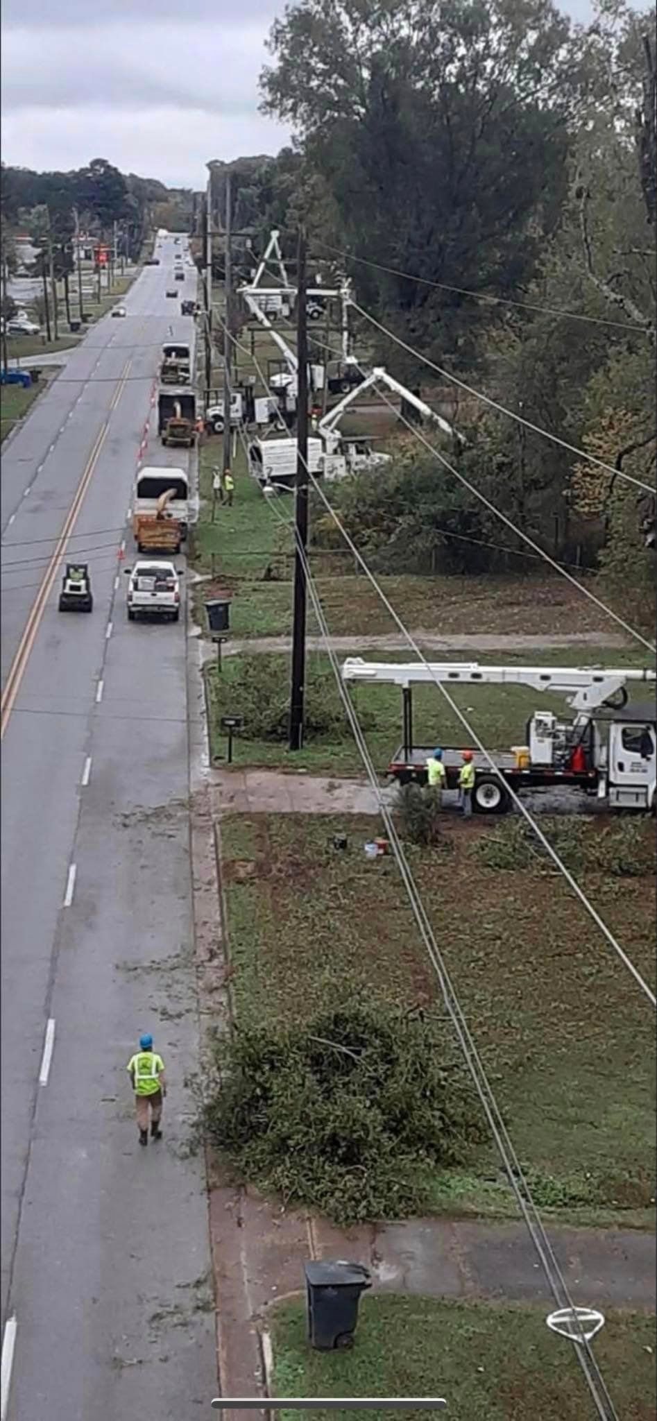 an aerial view of a street with a lot of power lines