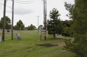 Electric post and trees