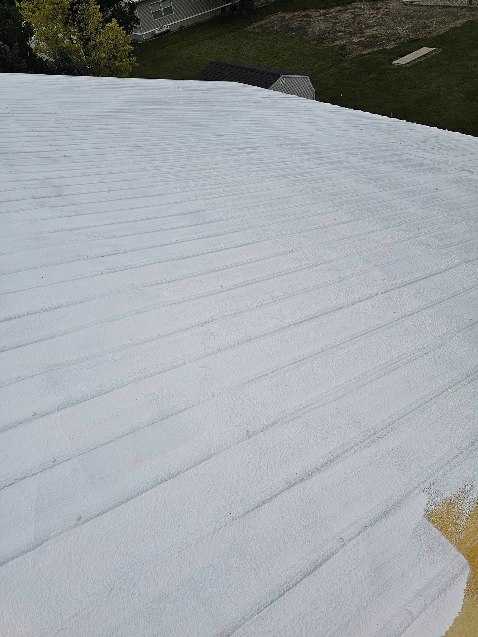 A roof with a lot of white paint on it.
