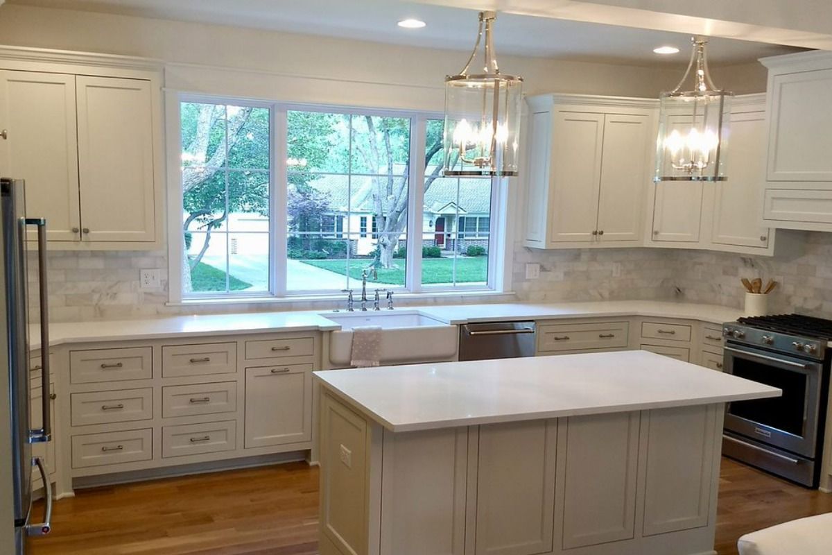 There is a large island in the middle of the kitchen.