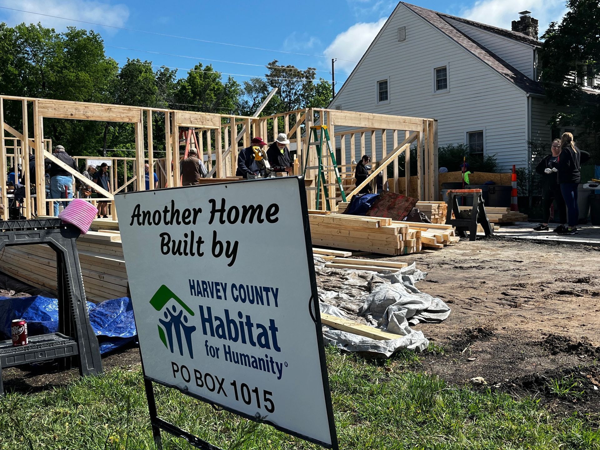 A sign that says another home built by Habitat
