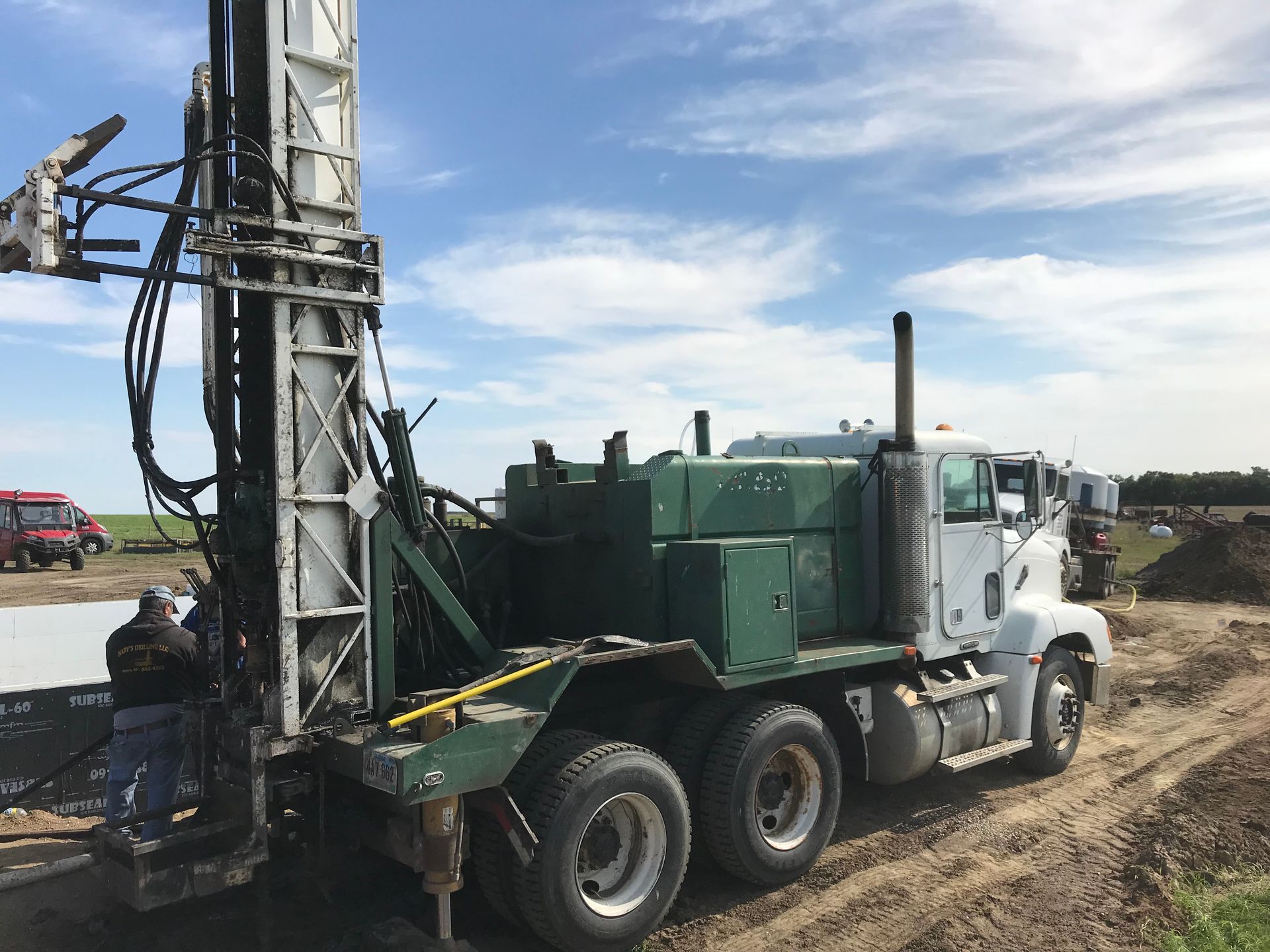 A race car is sponsored by harv's plumbing