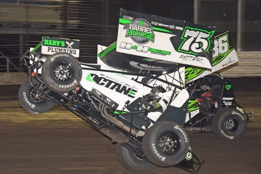 A race car is sponsored by harv 's plumbing