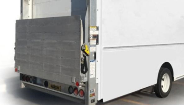 Rear view of a white delivery truck with a lift gate.