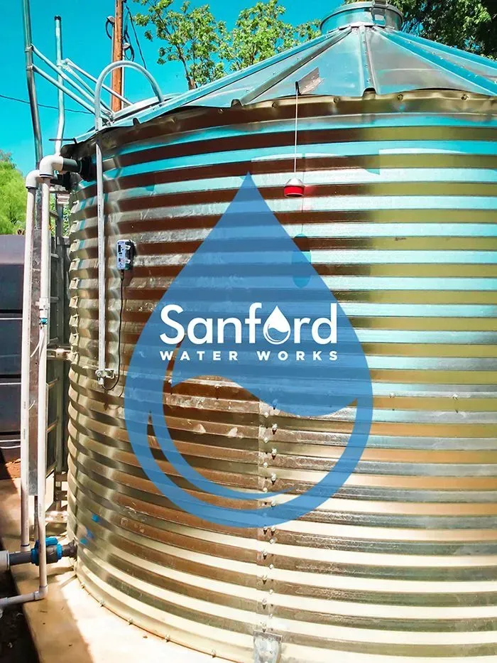Large corrugated metal water tank with 