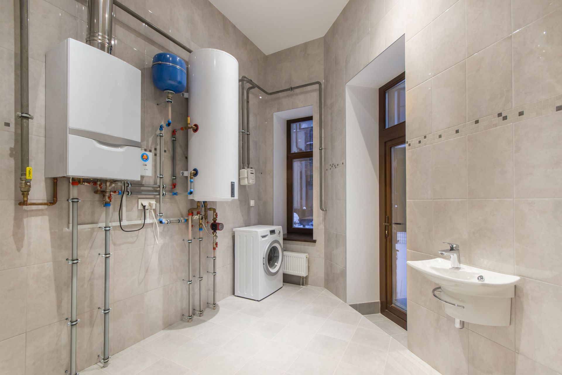 Room with a water heater and washer/dryer
