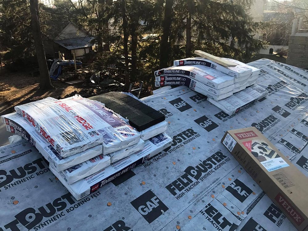 A roof with a lot of roofing materials on it