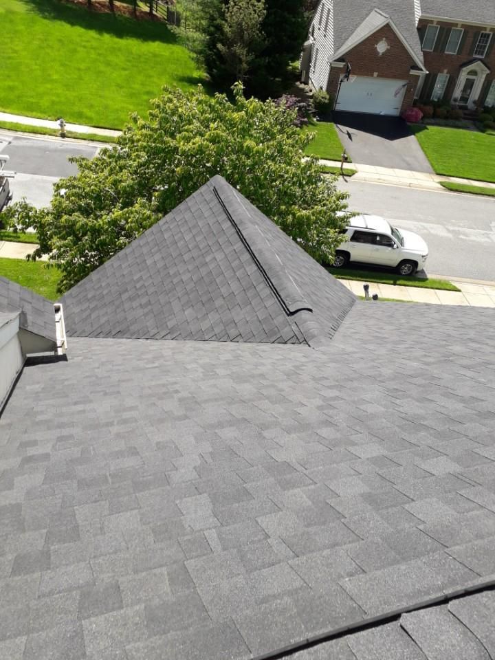 An aerial view of a roof with a white truck parked on it