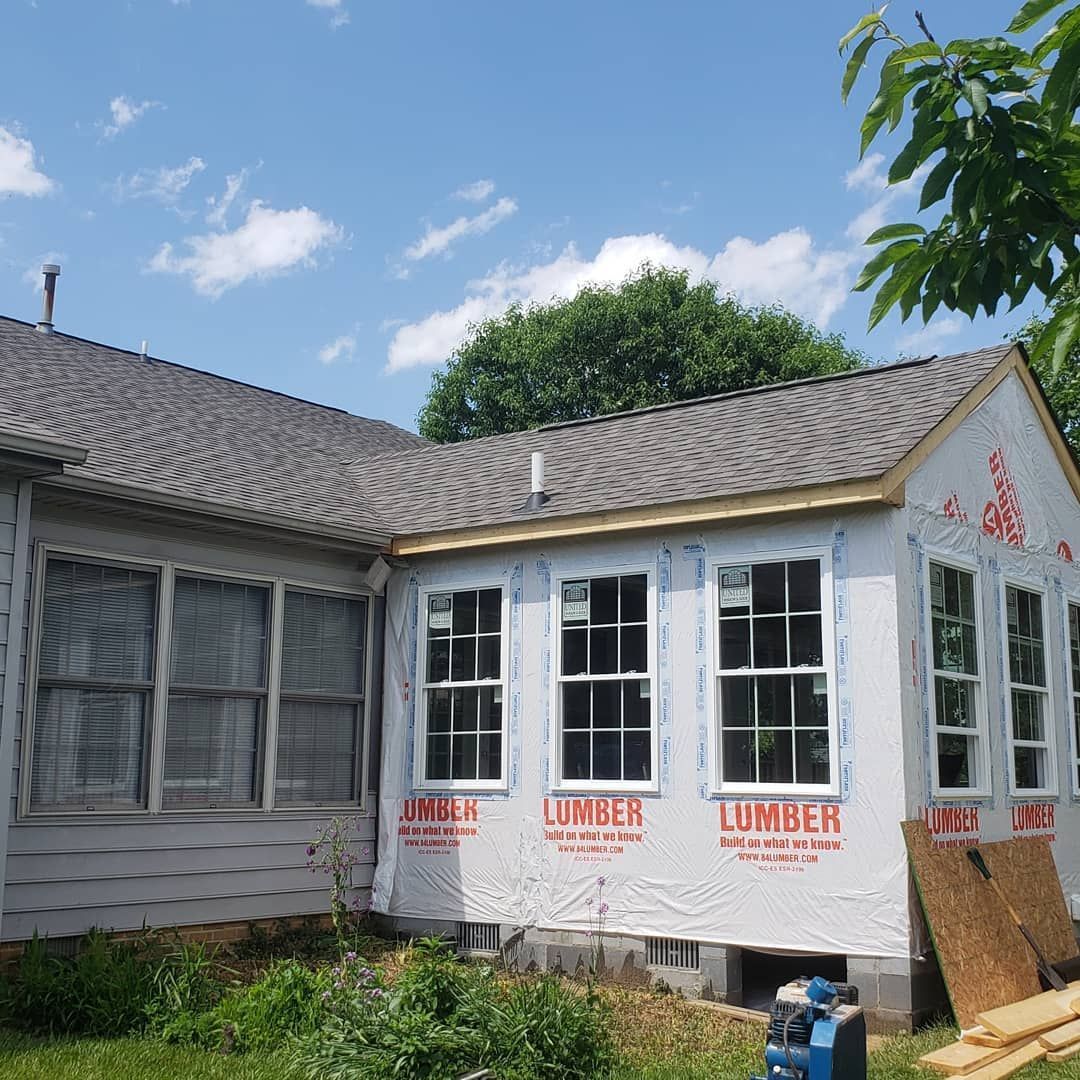 A house with lumber sheathing on the side of it
