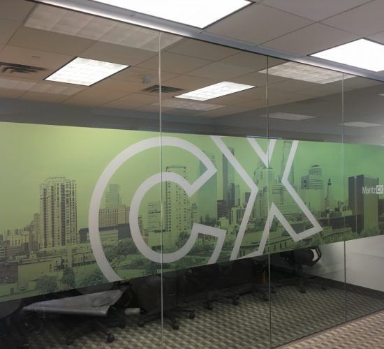 Glass-walled office with skyline and 