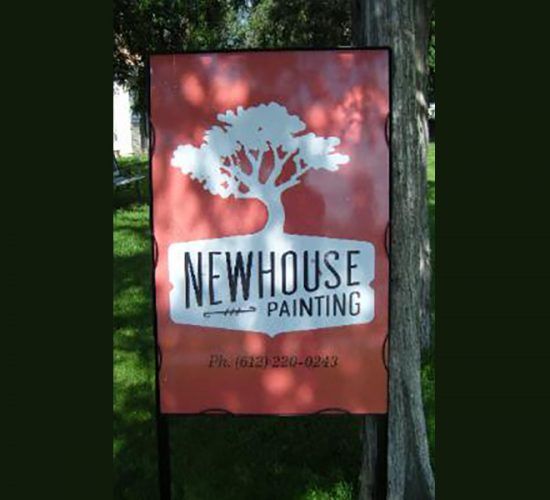 Sign for Newhouse Painting, featuring a white tree graphic on a red background with company name and phone number.