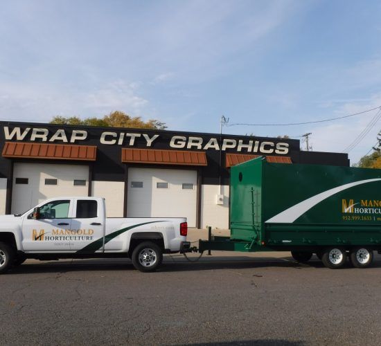 White truck and green trailer with 