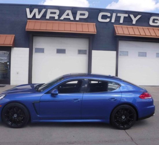 Blue Porsche parked outside 