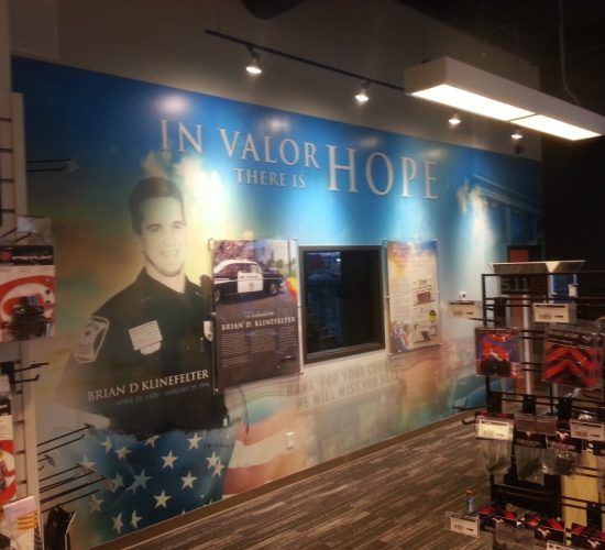 Wall mural in a store honoring fallen officer Brian D. Hinz, with the words 