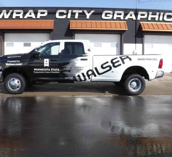 A white and black pickup truck with 