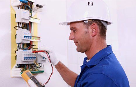 Electrical contractor checking the electrical panel