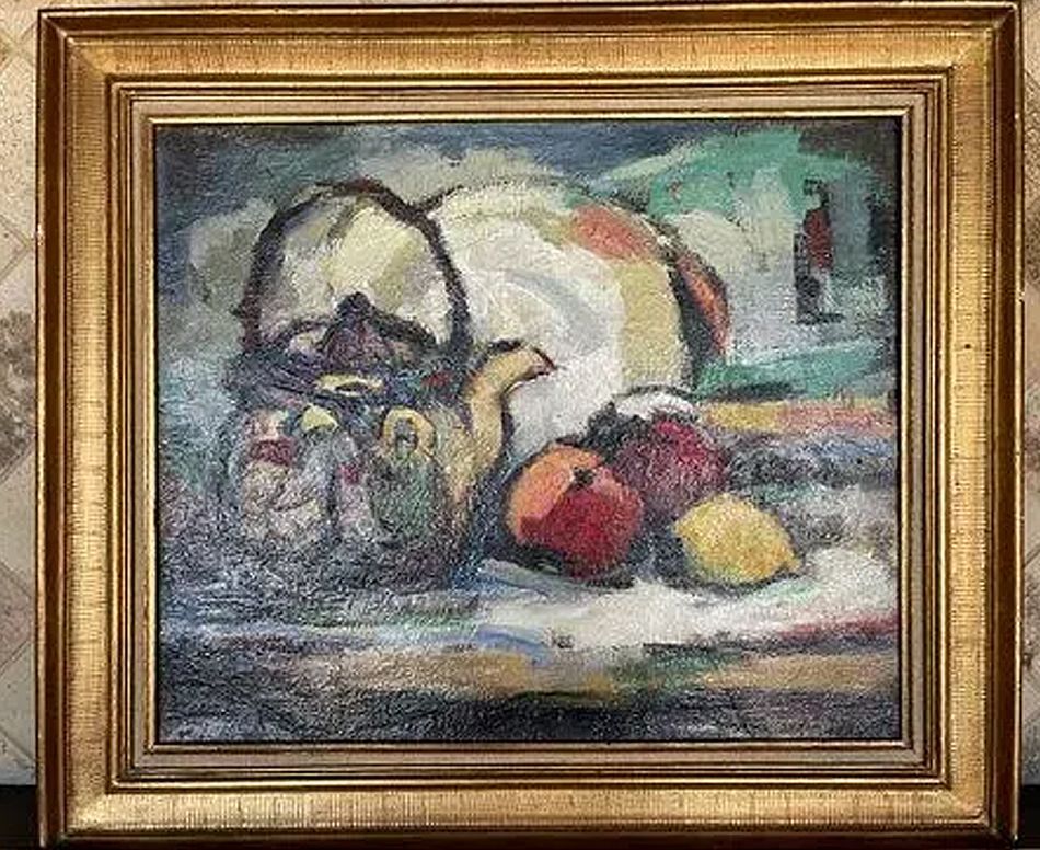 Still life painting of a basket, apples, and lemon in a gold frame.