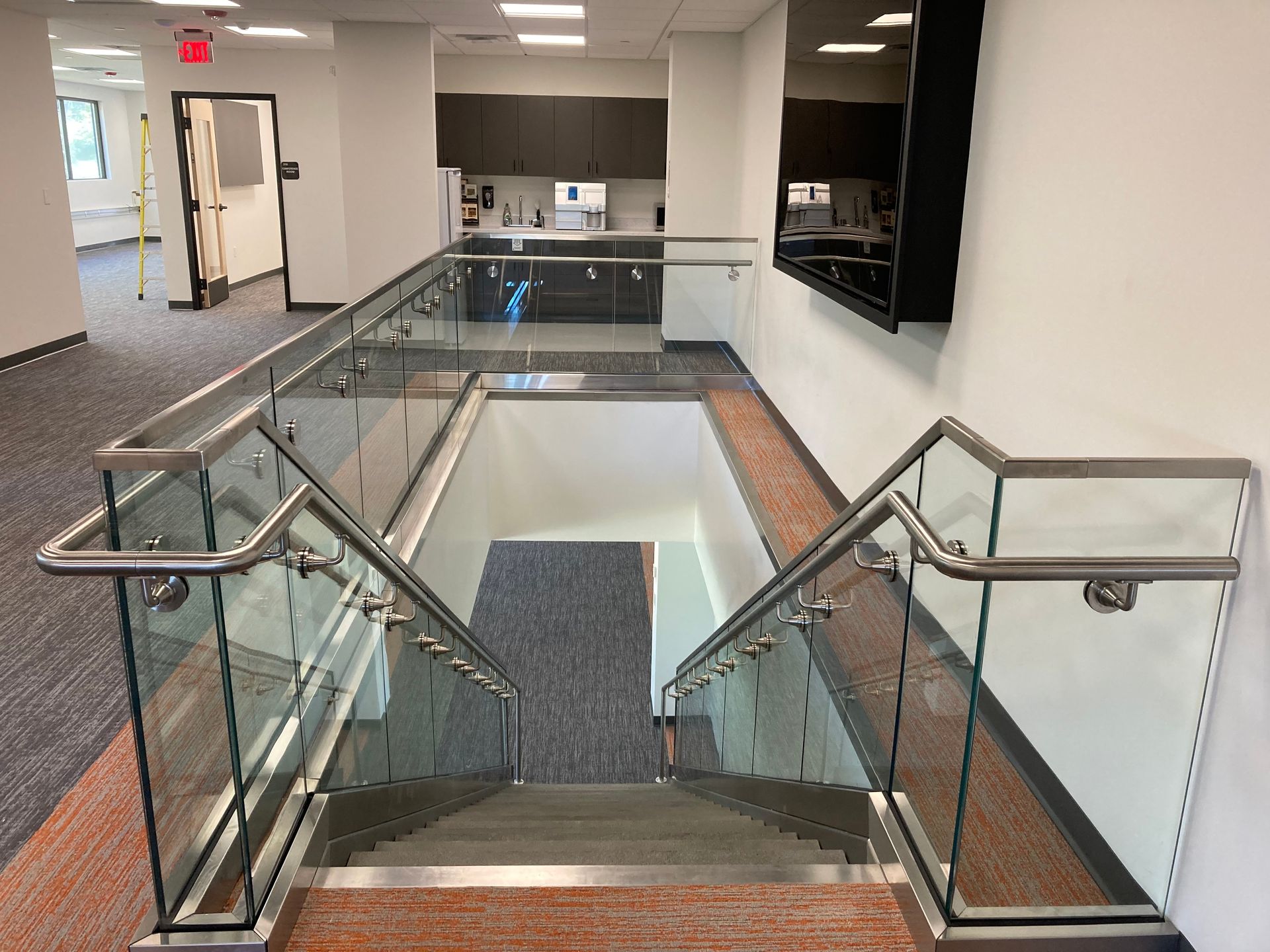 A large bay window on the side of a brick building.